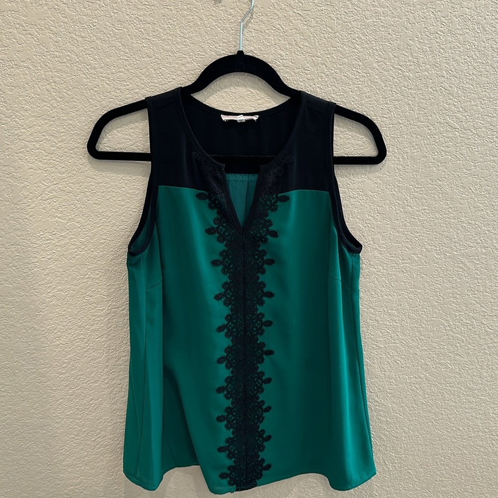 Women’s green and black appliqué top